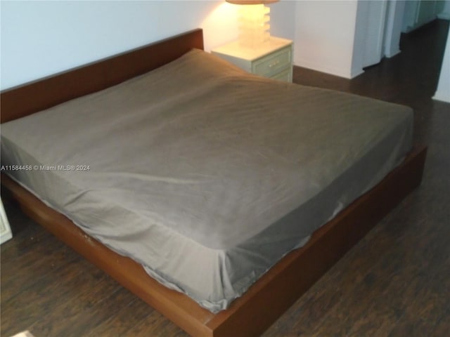 bedroom featuring dark hardwood / wood-style floors