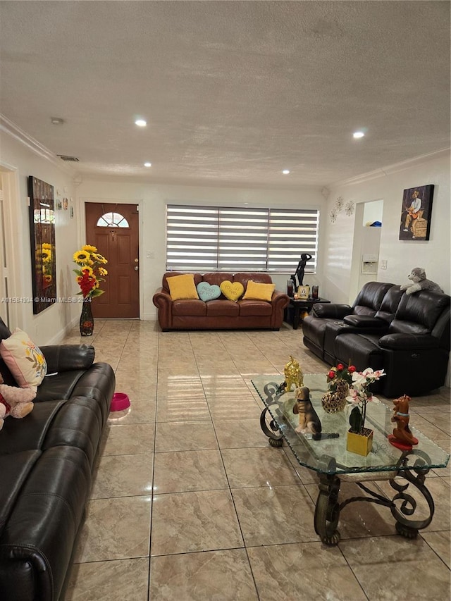 tiled living room featuring a textured ceiling and crown molding