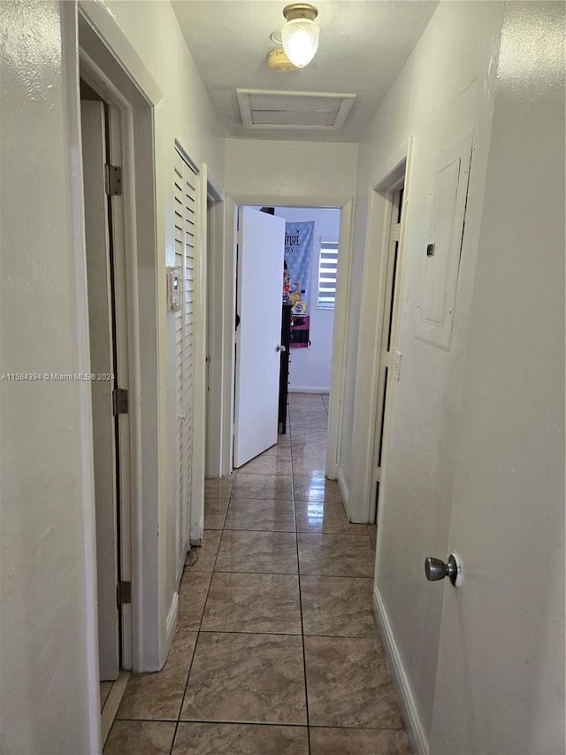 corridor with tile patterned flooring