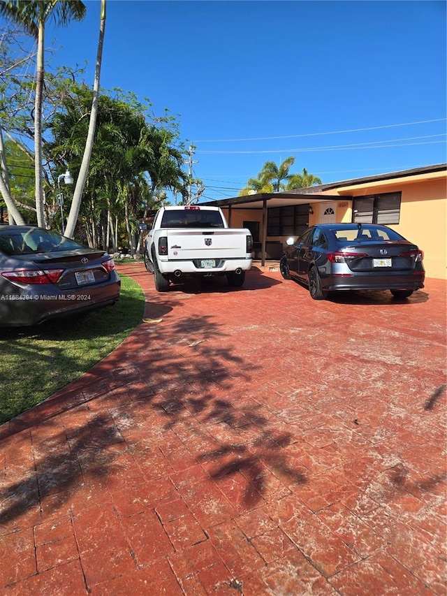 exterior space with a carport