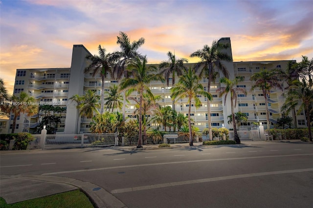 view of outdoor building at dusk