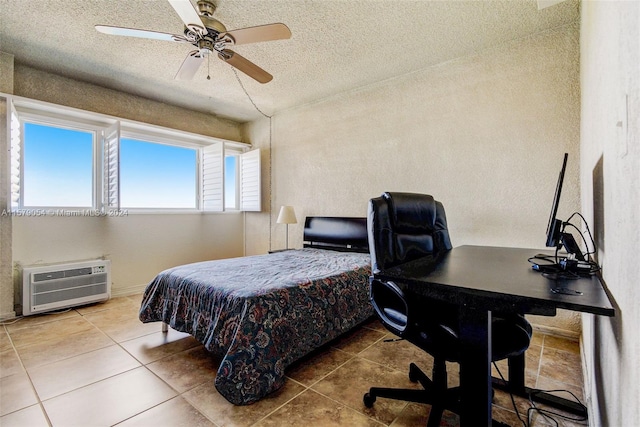 tiled bedroom featuring a textured ceiling and ceiling fan