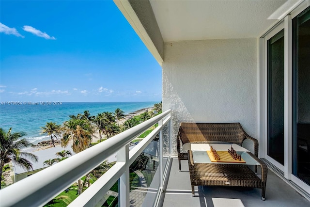 balcony featuring a water view