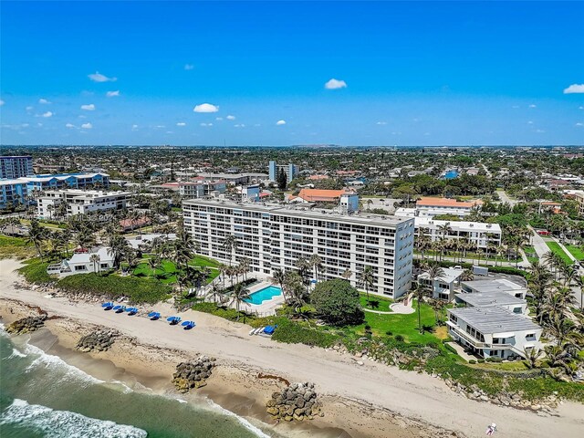 drone / aerial view with a view of the beach and a water view