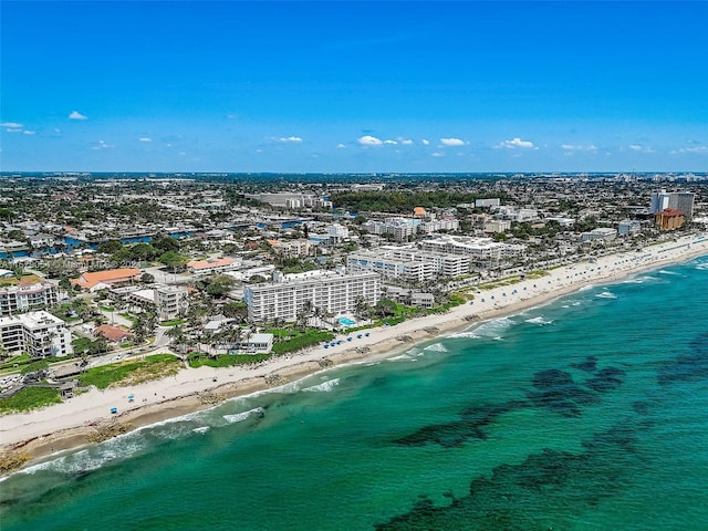 bird's eye view with a beach view and a water view