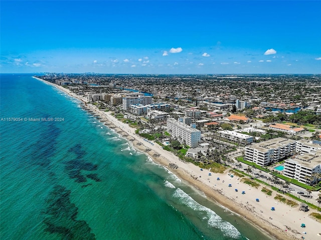 bird's eye view with a beach view and a water view