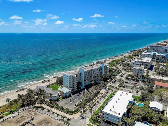 bird's eye view featuring a beach view and a water view