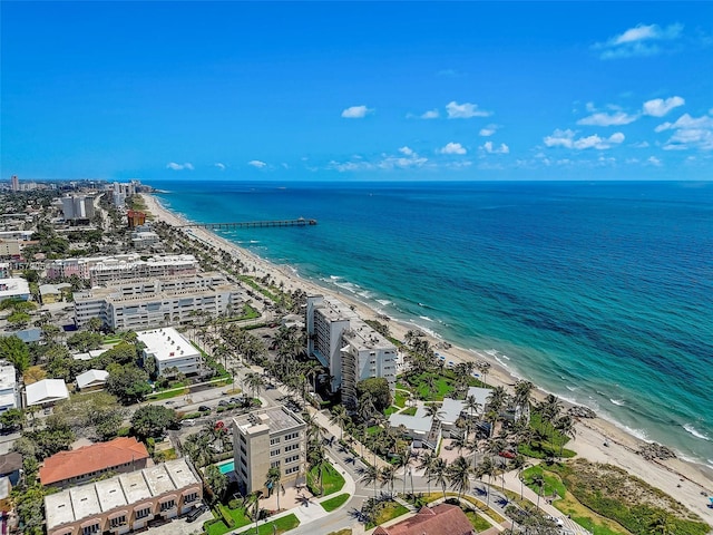 birds eye view of property with a beach view and a water view