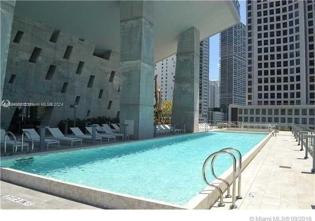 view of swimming pool featuring a patio