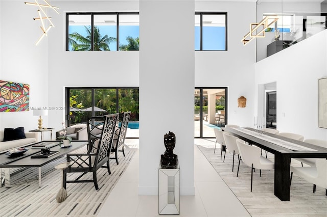 tiled dining area featuring a high ceiling