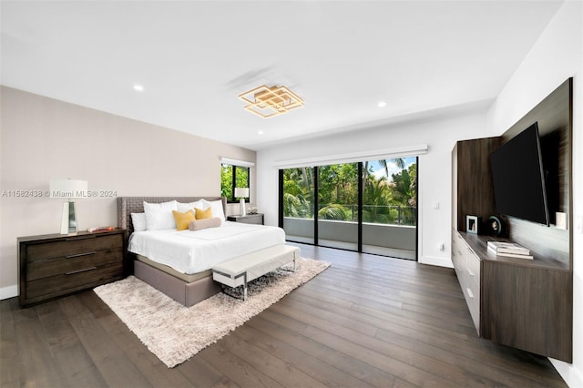 bedroom with dark hardwood / wood-style floors and access to exterior