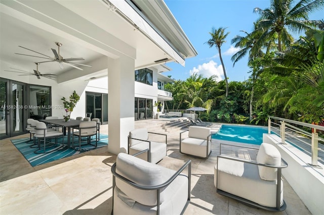 view of patio / terrace with ceiling fan and a balcony