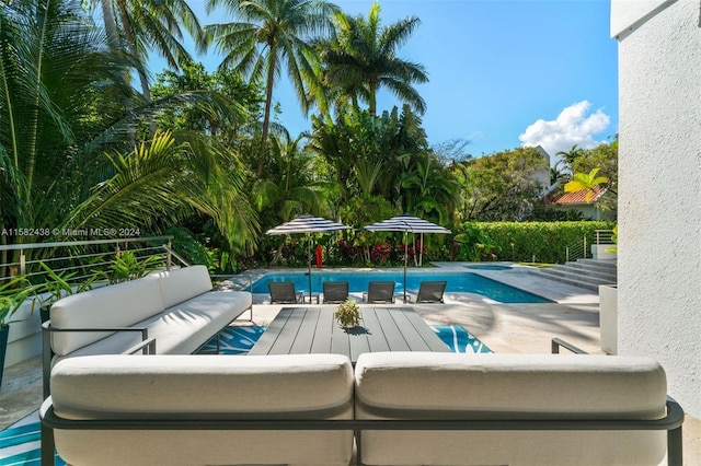 view of swimming pool with a patio area