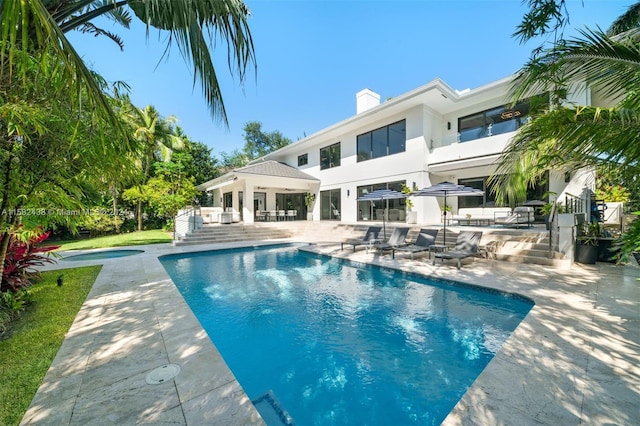 view of swimming pool with a patio area