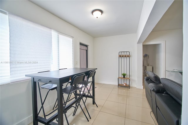 dining space with light tile patterned flooring