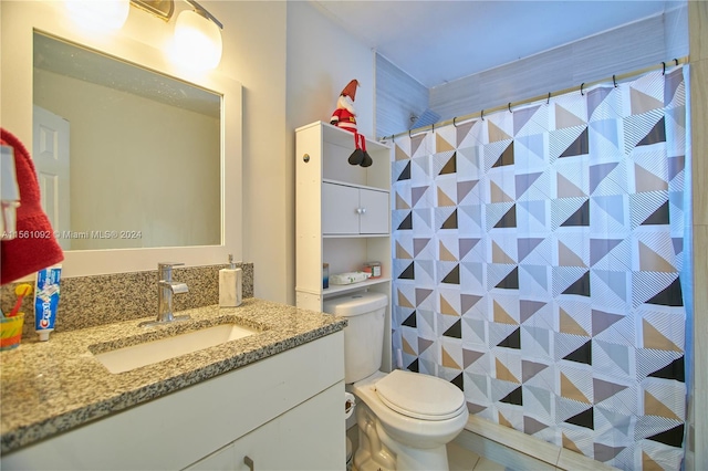 bathroom with toilet and vanity