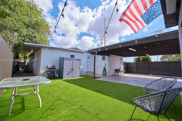 back of house with central AC unit, a yard, and a patio area