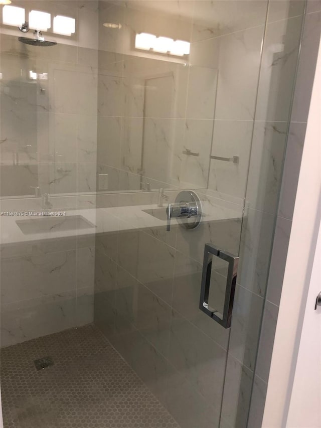 bathroom with tiled shower