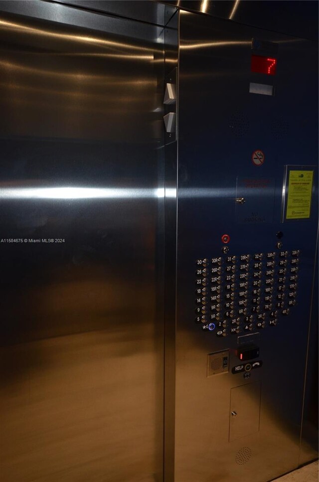 details featuring wood-type flooring and elevator