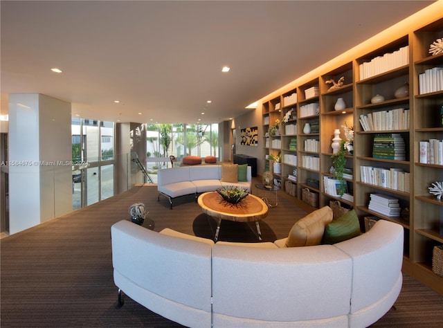 living room featuring a wall of windows and french doors