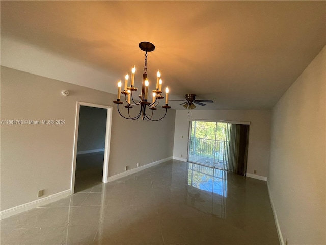 spare room with tile patterned floors and ceiling fan with notable chandelier