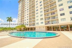 view of pool featuring a patio