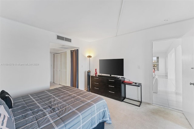 carpeted bedroom with a closet