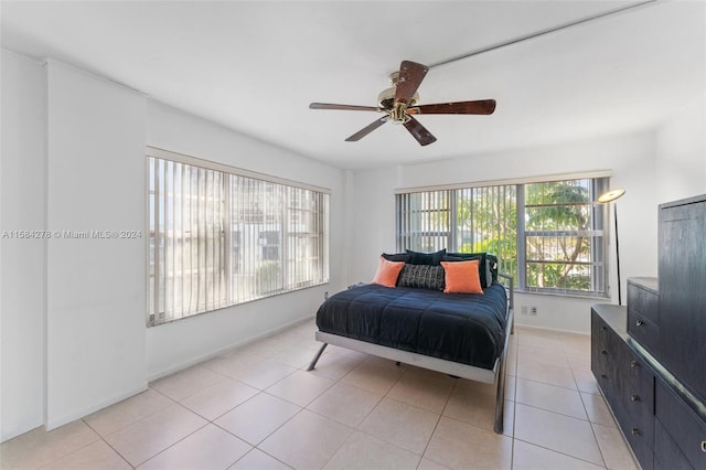 bedroom featuring ceiling fan and light tile flooring