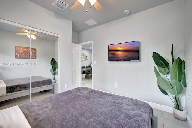 unfurnished bedroom featuring a closet, ceiling fan, and tile floors