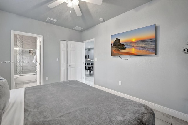 bedroom featuring ceiling fan, ensuite bathroom, and light tile floors