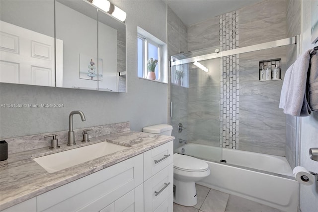 full bathroom featuring enclosed tub / shower combo, toilet, tile floors, and vanity