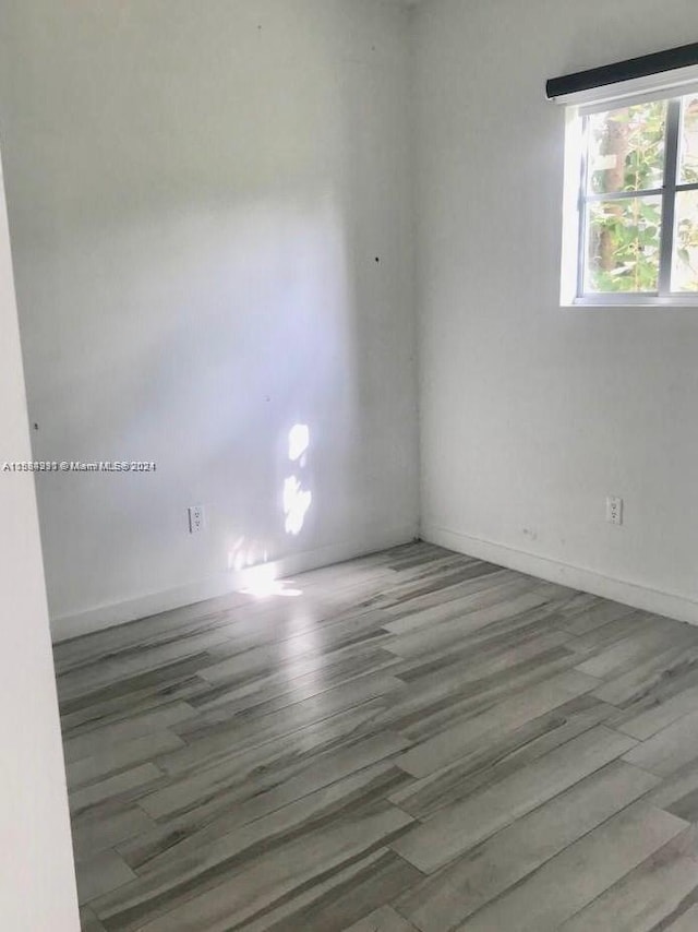 empty room featuring dark hardwood / wood-style floors