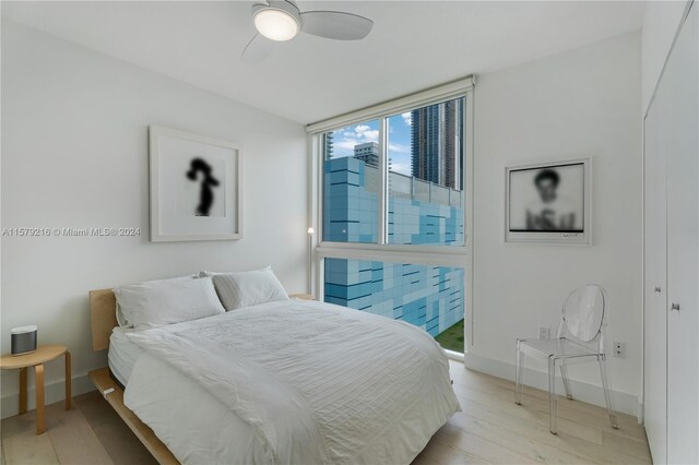 bedroom featuring ceiling fan and light wood-type flooring