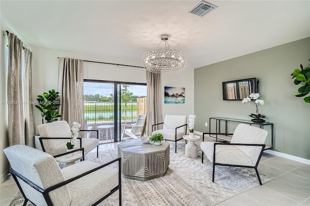 living room with an inviting chandelier and tile flooring