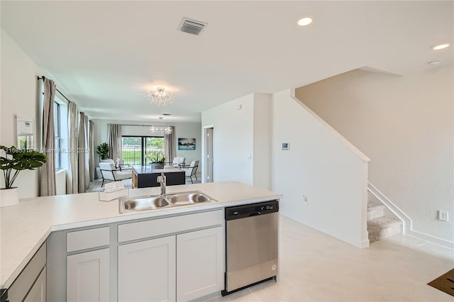 kitchen with dishwasher, white cabinetry, and sink