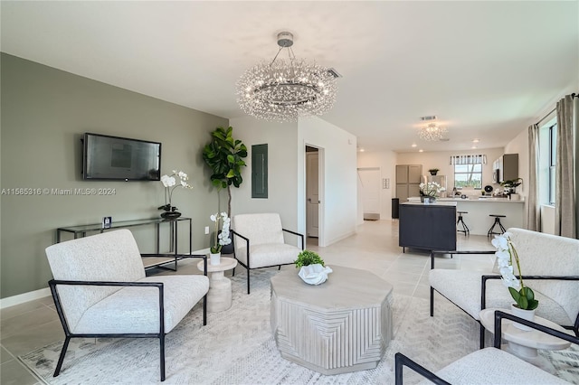 living room with a notable chandelier and light tile floors