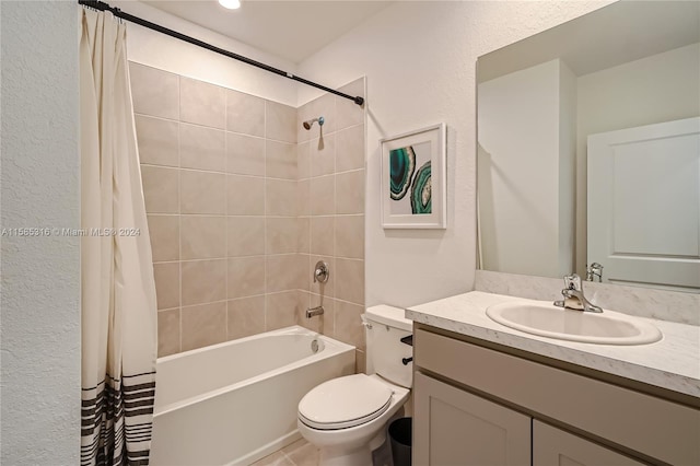 full bathroom featuring shower / tub combo with curtain, large vanity, and toilet