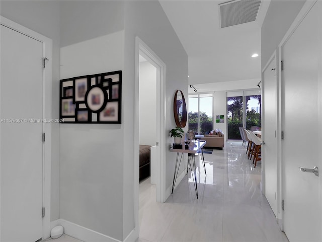 hallway with light tile floors