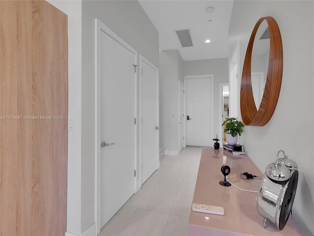 hallway with light tile floors