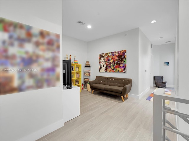 living area with light hardwood / wood-style floors