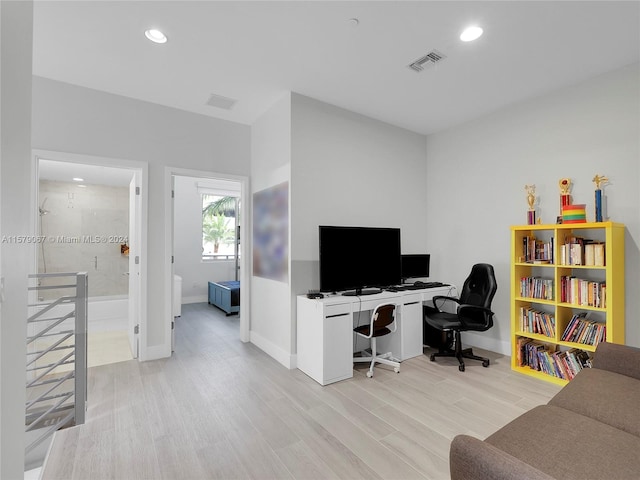 office with light hardwood / wood-style floors