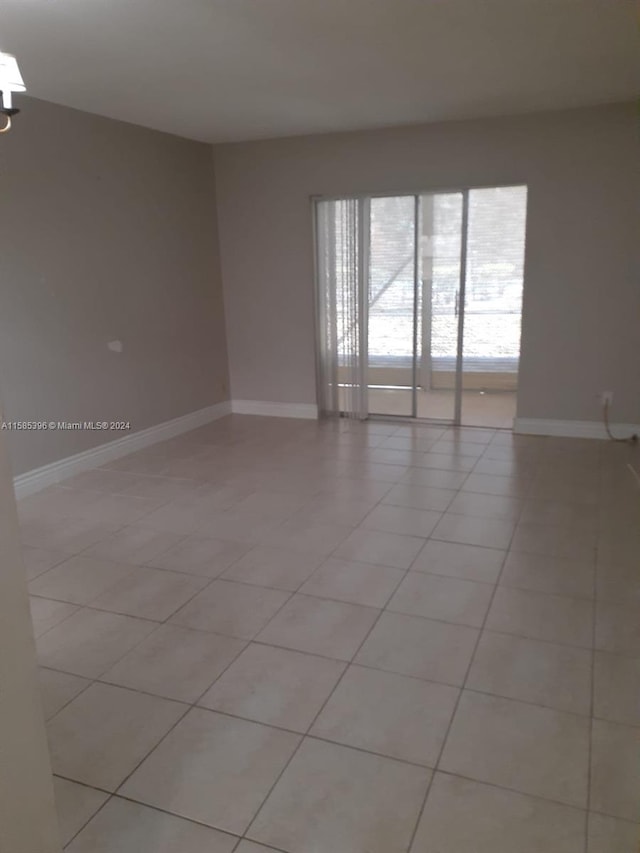 empty room with light tile flooring