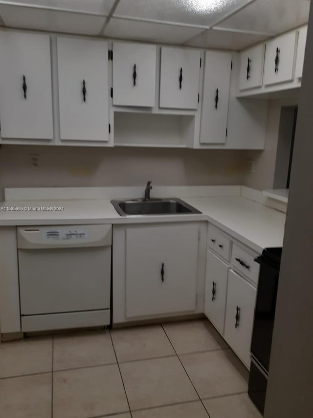 kitchen with white cabinets, sink, dishwasher, and light tile flooring