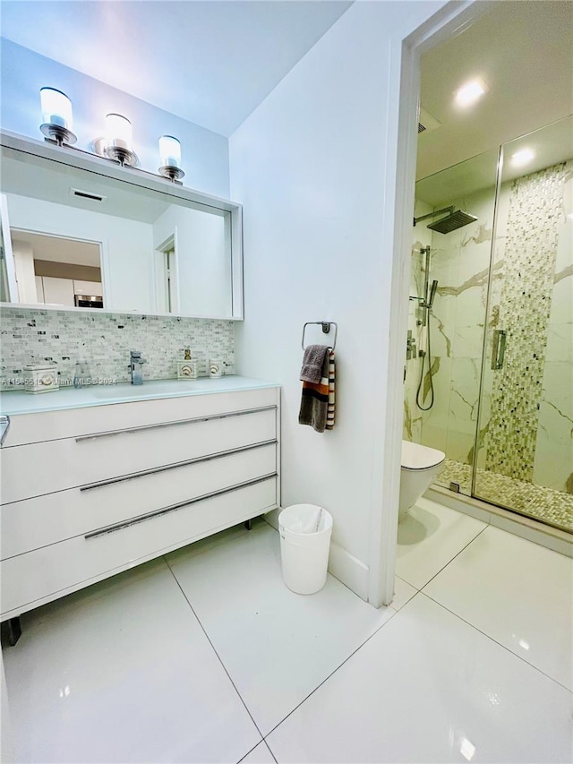 bathroom with backsplash, an enclosed shower, vanity, and tile floors