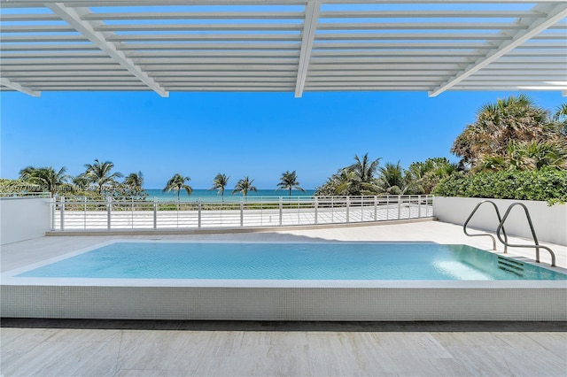 view of pool featuring a water view