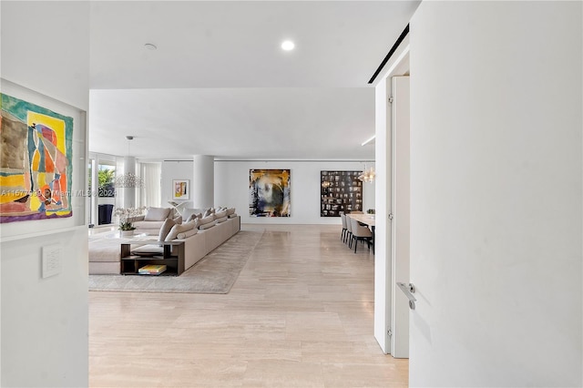 living room with an inviting chandelier