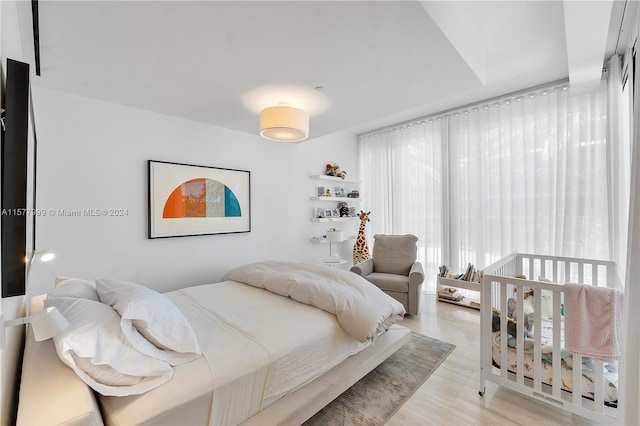 bedroom with light hardwood / wood-style floors