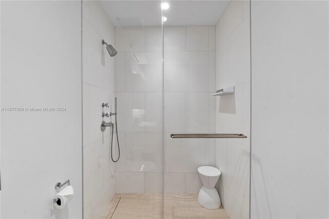 bathroom featuring an enclosed shower