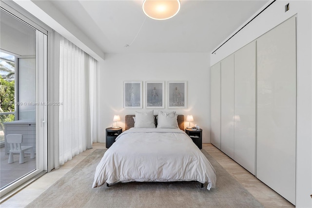 bedroom with light wood-type flooring