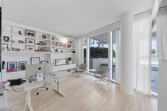 living area featuring built in features and wood-type flooring